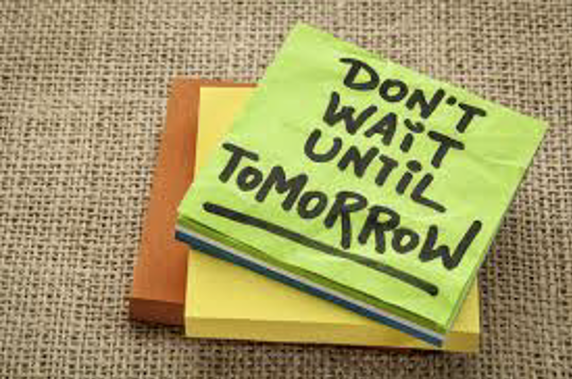 Image of a stack of post-it notes, with the top note reading "Don't wait until tomorrow."